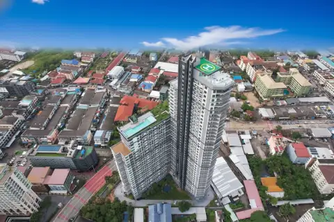 Arcadia Millennium Tower aerial view showing two modern high-rise buildings with a helipad, surrounded by urban landscape.