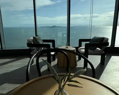 1 Bedroom Condo for Rent at Arom Wongamat lounge seating area overlooking the ocean and islands