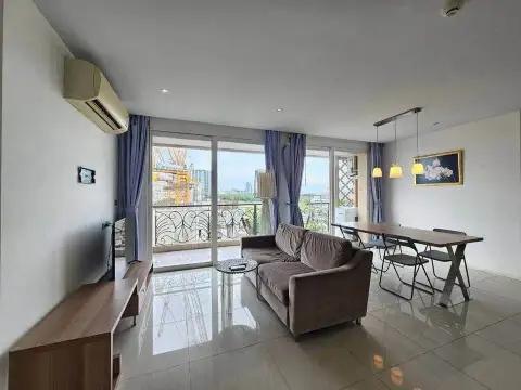 2 Bedroom Condo for Sale at Atlantis Condo Resort living room with sofa, dining table and city view balcony