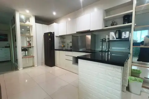 2 Bedroom Condo for Sale & Rent at Atlantis Condo Resort white kitchen with black countertop and refrigerator