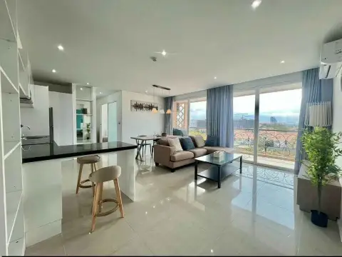 2 Bedroom Condo for Sale at Atlantis Condo Resort open-plan kitchen with breakfast bar and living area