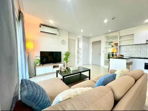 2 Bedroom Condo for Sale at Atlantis Condo Resort cozy sofa seating with mood lighting and kitchen view