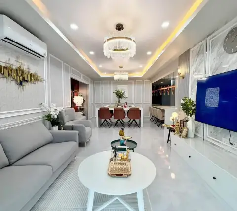 4 Bedroom House for Sale at Baan Pruksa Nara Chaiyapruek spacious living room with marble flooring and wall-mounted TV