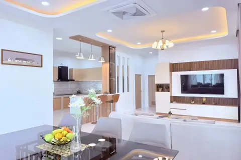 3 Bedroom House for Sale at Boonraksa​ Haven​ open-plan living and dining area with modern kitchen, pendant lights, and TV unit