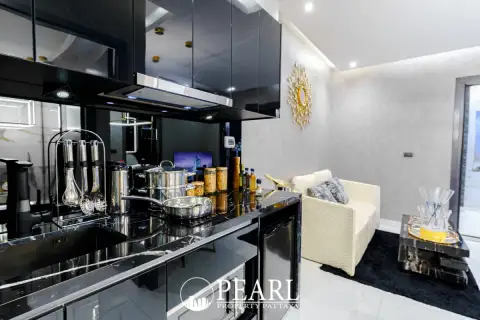1 Bedroom Condo for Sale at Grand Solaire Pattaya sleek kitchen and dining area