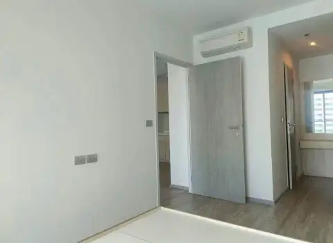 1 Bedroom Condo for Sale at Cetus Beachfront hallway with bedroom door, air conditioner and wood flooring