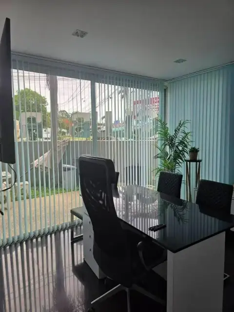 1 Bedroom Condo for Sale at Club Royal balcony area with glass table and street view through blinds