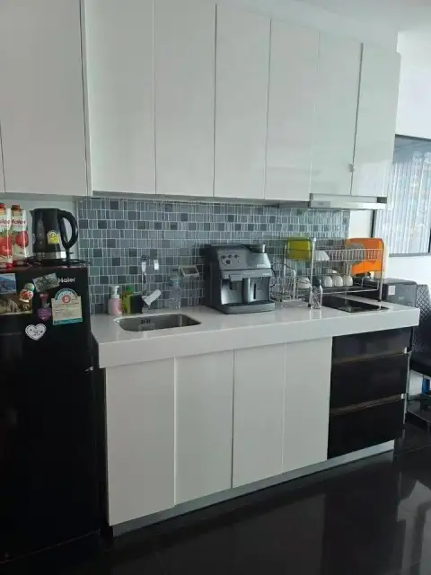 1 Bedroom Condo for Sale at Club Royal kitchen with white cabinets, sink, and espresso machine