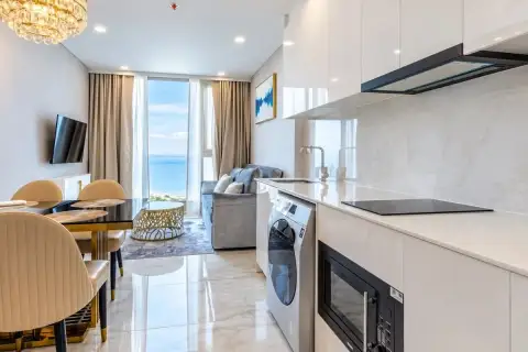 1 Bedroom Condo for Sale at Copacabana Beach Jomtien kitchen counter overlooking living area and ocean view