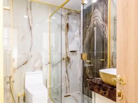 2 Bedroom Condo for Rent at Copacabana Beach Jomtien marble shower stall with glass door and gold fixtures