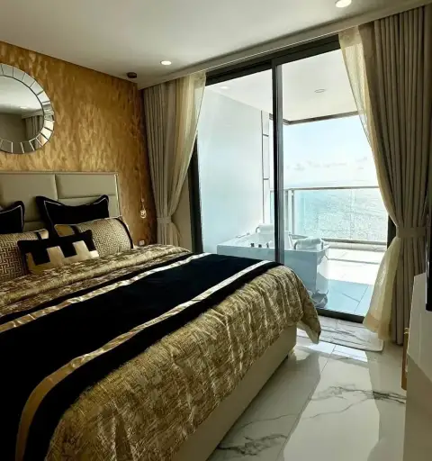 2 Bedroom Condo for Rent at Copacabana Beach Jomtien bedroom with jacuzzi tub on balcony overlooking the sea