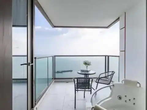 2 Bedroom Condo for Rent at Copacabana Beach Jomtien balcony with ocean view, seating area and jacuzzi tub