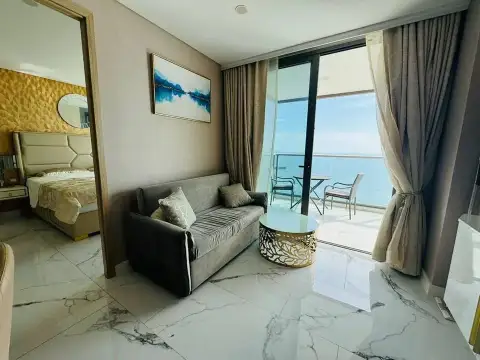 2 Bedroom Condo for Sale at Copacabana Beach Jomtien gray sofa and balcony with panoramic ocean view