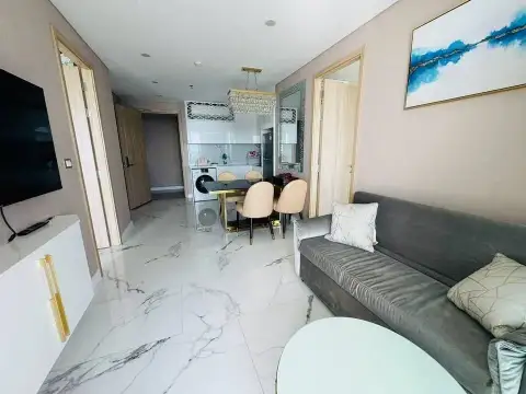 2 Bedroom Condo for Sale at Copacabana Beach Jomtien hallway view of living area, dining table, and kitchen with marble floors