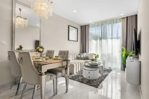 1 Bedroom Condo for Sale at Copacabana Coral Reef open-plan living and dining space with sheer curtains