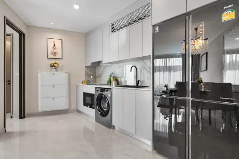 1 Bedroom Condo for Sale at Copacabana Coral Reef kitchen with washing machine, microwave and black fridge