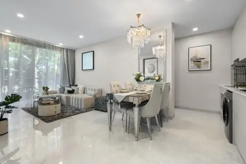 1 Bedroom Condo for Sale at Copacabana Coral Reef dining area with crystal chandelier and mirrored table near living room