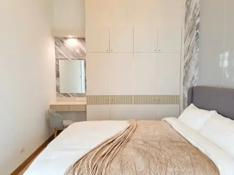 4 Bedroom House for Sale in Huai Yai bedroom with white wardrobe, dressing mirror and upholstered bed