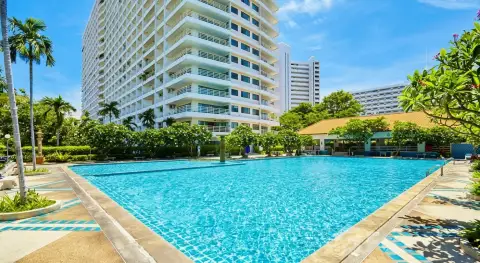 View Talay 5D large pool with fountain, tropical landscaping and building facade
