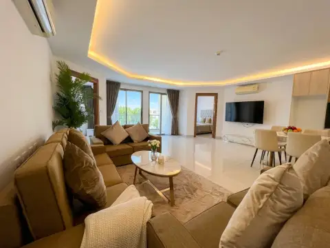 2 Bedroom Condo for Sale at Laguna Beach Resort 3 (The Maldives) spacious living area with balcony view, TV, and dining set