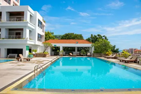 Pattaya Hill Resort outdoor swimming pool with lounge chairs and poolside pavilion