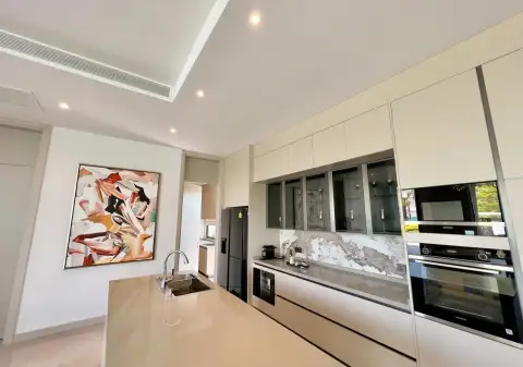 4 Bedroom House for Sale at Glory Village Pattaya kitchen with marble backsplash and built-in appliances