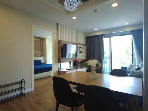 2 Bedroom Condo for Sale at Dusit Grand Park 1 open-plan dining area with view into bedroom and balcony