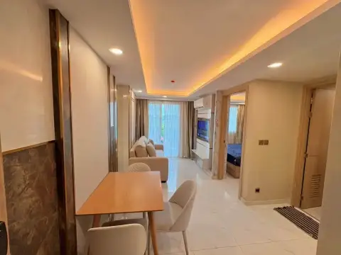 1 Bedroom Condo for Sale at Dusit Grand Park 2 open-plan layout showing dining area, living room and bedroom entrance