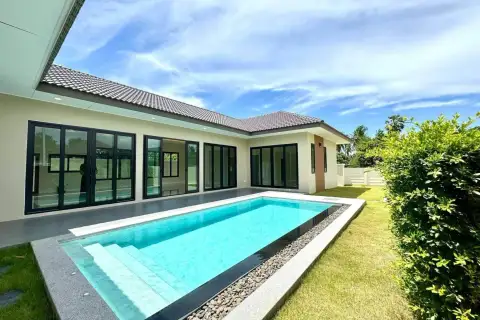 3 Bedroom House for Sale in East Pattaya corner view of pool, tiled terrace and modern exterior windows