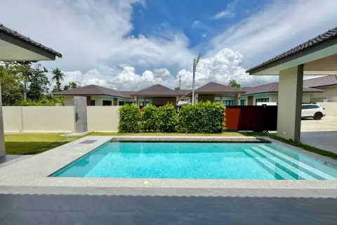 3 Bedroom House for Sale in East Pattaya front pool area with garden shower and neighboring houses