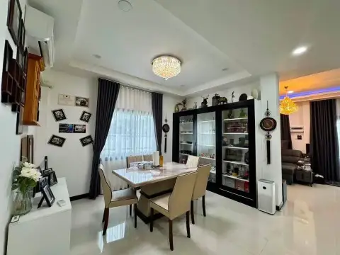 3 Bedroom House for Sale in East Pattaya dining area with marble table, display cabinet, and chandelier