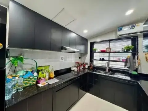 3 Bedroom House for Sale in East Pattaya modern black kitchen with countertop and window view