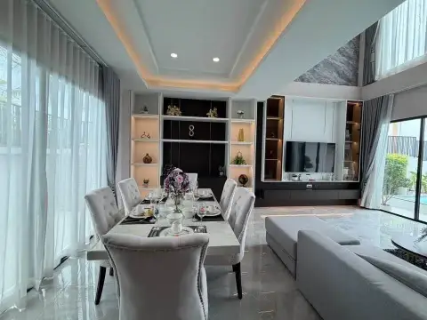 4 Bedroom House for Sale in East Pattaya elegant dining room with upholstered chairs and marble flooring