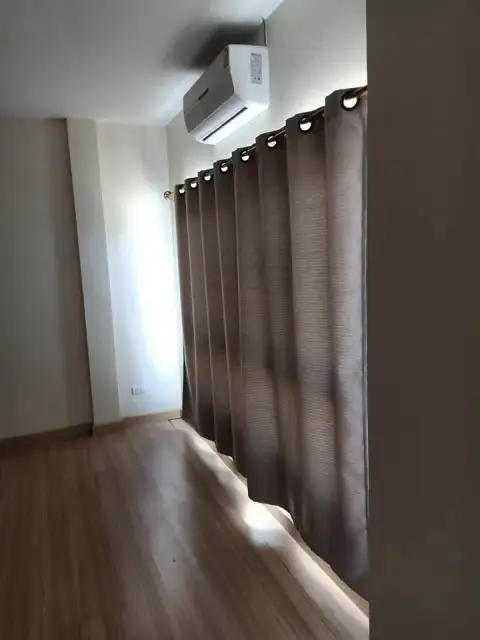 2 Bedroom Townhouse for Rent in East Pattaya bedroom nook with wood flooring and wall-mounted air conditioner