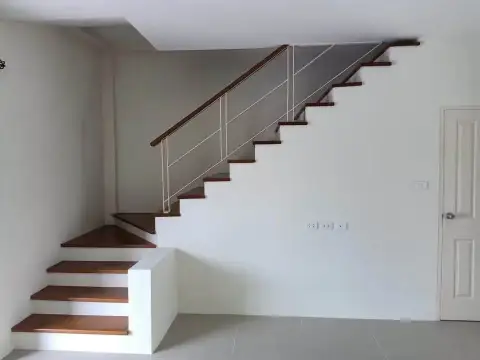 2 Bedroom Townhouse for Rent in East Pattaya wooden staircase leading to the upper floor