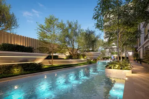 Avenue Boutique Pattaya: Outdoor swimming pool with blue lighting, surrounded by trees and modern landscaping.