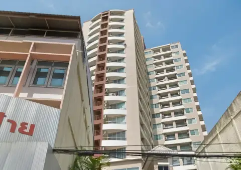 Sriracha Condo View curved balconies on high-rise facade viewed from street level