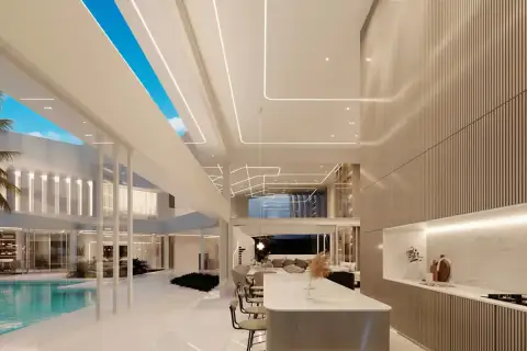 Glory Village Pattaya modern house upper floor with sleek design, illuminated ceilings, and glass railings.