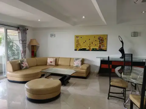 3 Bedroom Condo for Sale at Grand Condotel lounge area with sectional sofa, dining table and artwork