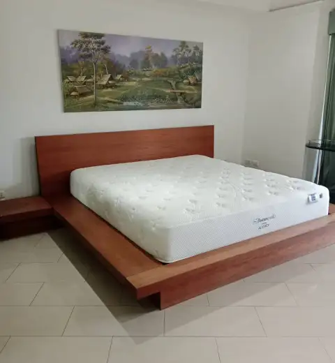 3 Bedroom Condo for Sale at Grand Condotel platform bed with wood headboard and framed landscape art