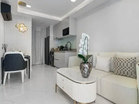 1 Bedroom Condo for Sale at Grand Solaire Noble lobby with marble floors and sculptural chandelier