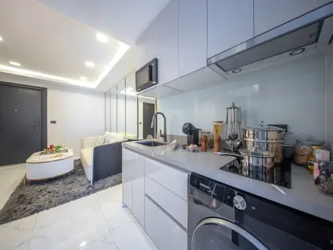 1 Bedroom Condo for Sale at Grand Solaire Noble bedroom with black marble accent wall and sheer curtains