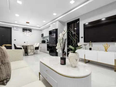 4 Bedroom Condo for Sale at Grand Solaire Noble dressing area with vanity table and mirrored wardrobe