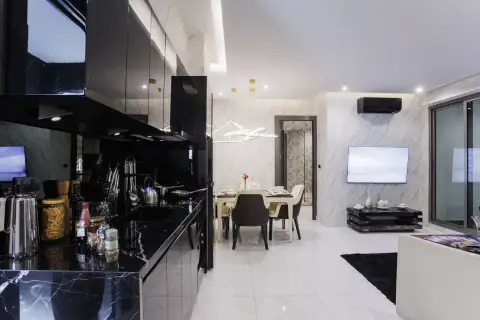 2 Bedroom Condo for Sale at Grand Solaire Pattaya kitchen counter with pasta jars overlooking dining table