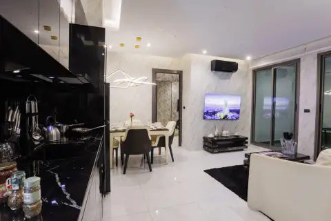 2 Bedroom Condo for Sale at Grand Solaire Pattaya open-plan kitchen and dining area with city view on TV