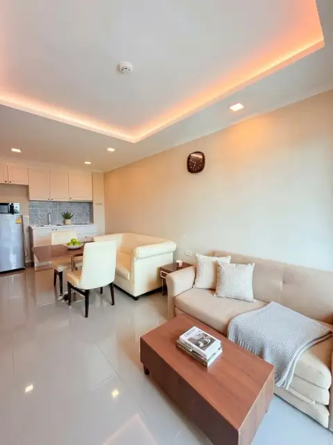 1 Bedroom Condo for Sale at The Orient Resort & Spa living room with sofa, coffee table and dining area