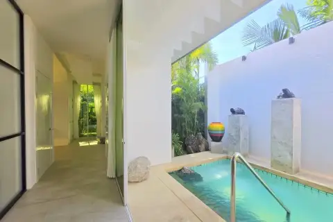 4 Bedroom House for Sale in Huai Yai hallway leading to outdoor plunge pool with decorative stone pillars