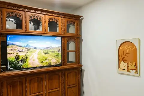 2 Bedroom House for Sale in Pratumnak Hill entertainment area with wooden cabinet and flat-screen TV