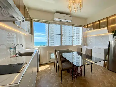 1 Bedroom Condo for Sale at Jomtien Complex modern kitchen counter with marble backsplash and sea view