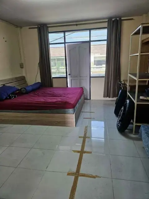 3 Bedroom House for Sale in Jomtien bedroom with double bed, balcony door and storage shelving